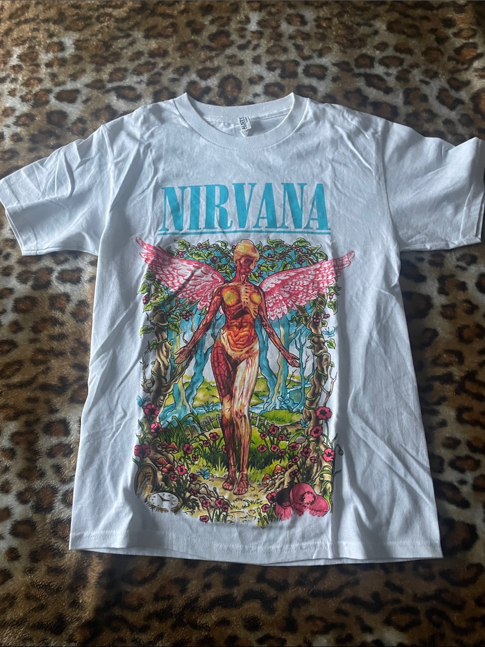NIRVANA White Tee with Pink Winged Figure and Teal Logo